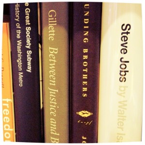 Steve Jobs book on a bookshelf with other books