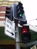 Traffic light, Don't Walk, and a One Way sign