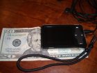 Meizu Miniplayer against a twenty dollar bill